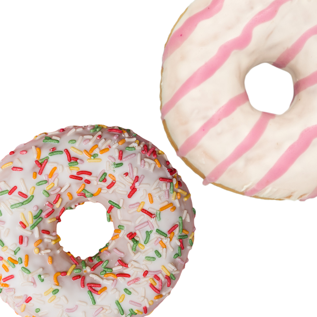 Two Donuts; one iced with pink stripes and the other one iced with rainbow sprinkles